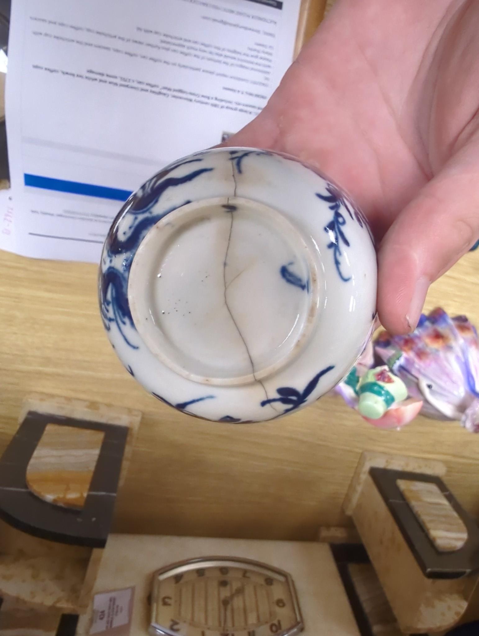 A large group of 18th century Worcester, Caughley and Liverpool blue and white tea bowls, coffee cups and saucers etc. including a Bow Cross-Legged Man